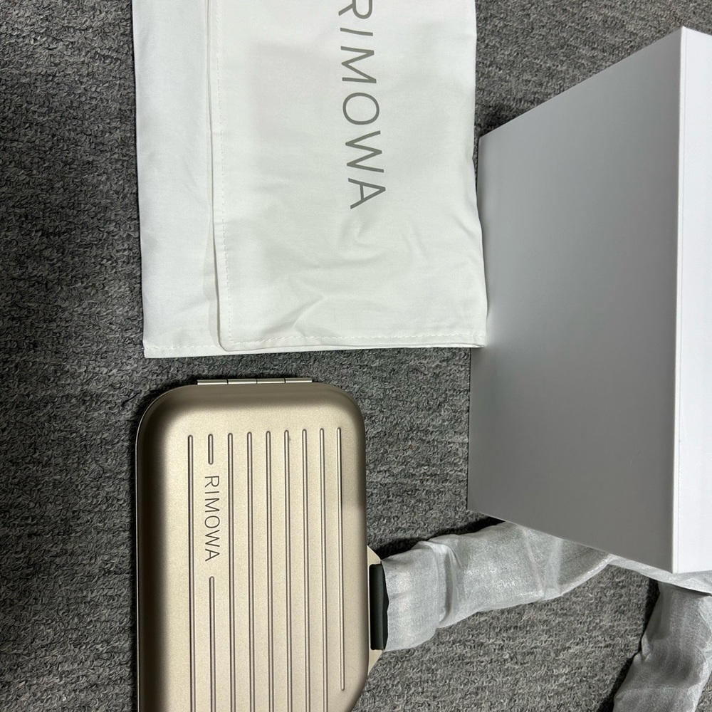 RIMOWA Metallic Gold Crossbody BagZimmerwa pocket
